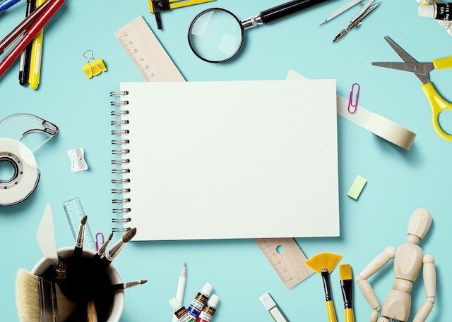 textbook with stationery on the table