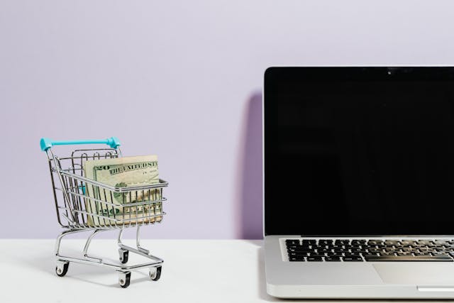 shopping-cart-next-to-a-laptop