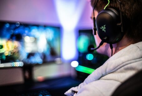 a-man-wearing-a-headset-and-using-a-computer